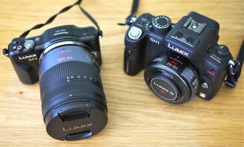 Gf3 with 14-140mm lens against a GH1 with X PZ 14-42mm lens